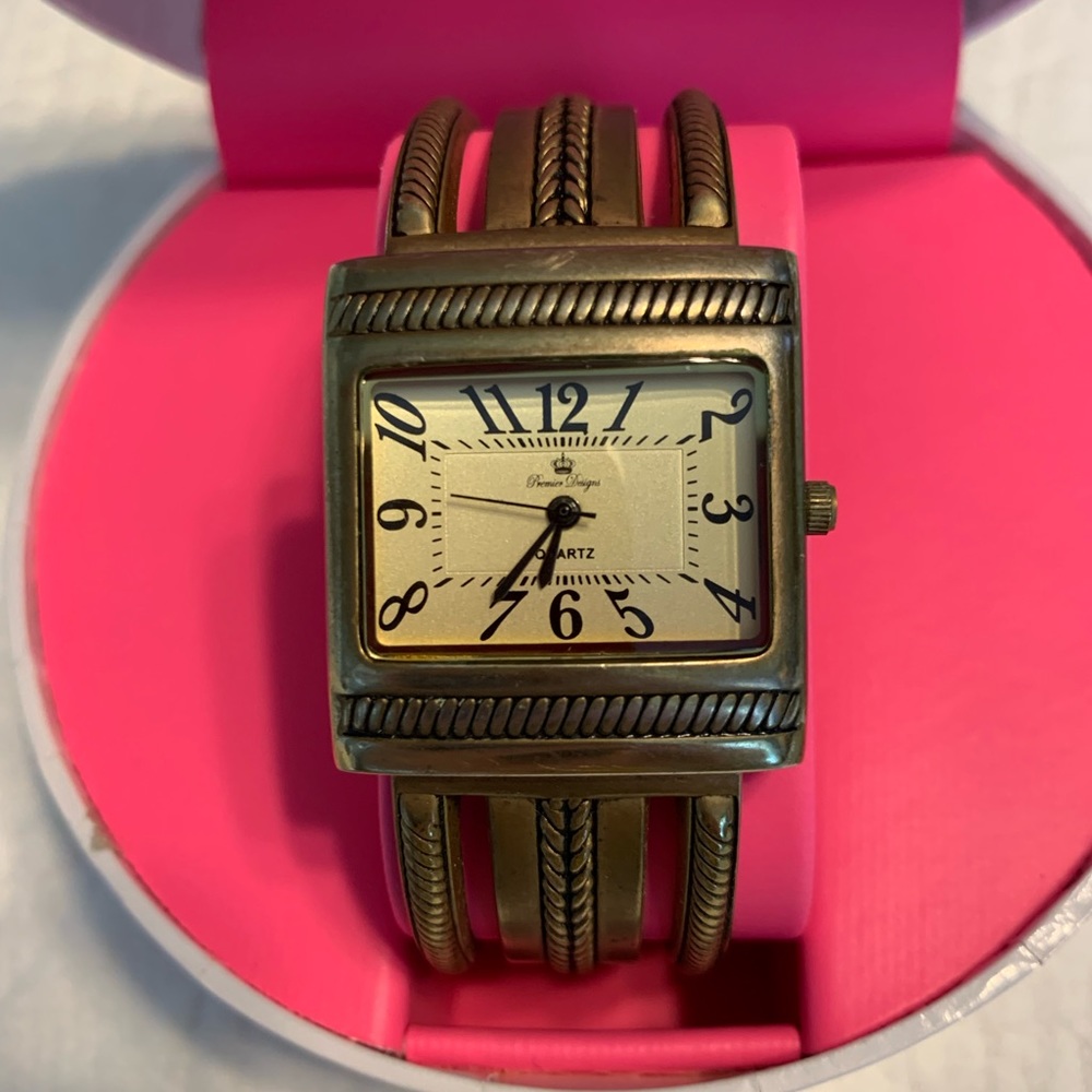 Brass tone hinged bangle watch